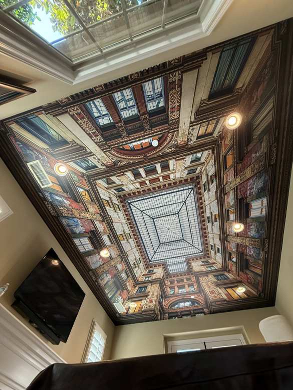 Trompe-l'oeil architectural mural installed on a ceiling