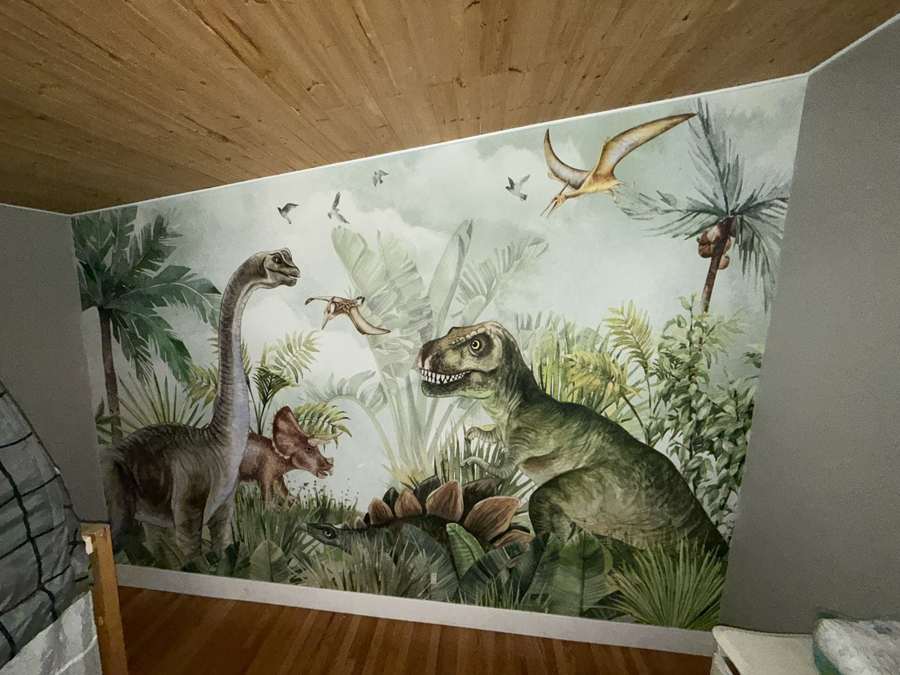 Dinosaur mural in a children's room